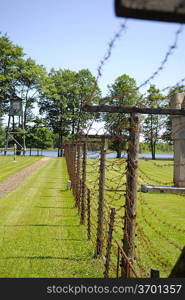 lake and fence from a barbed wire