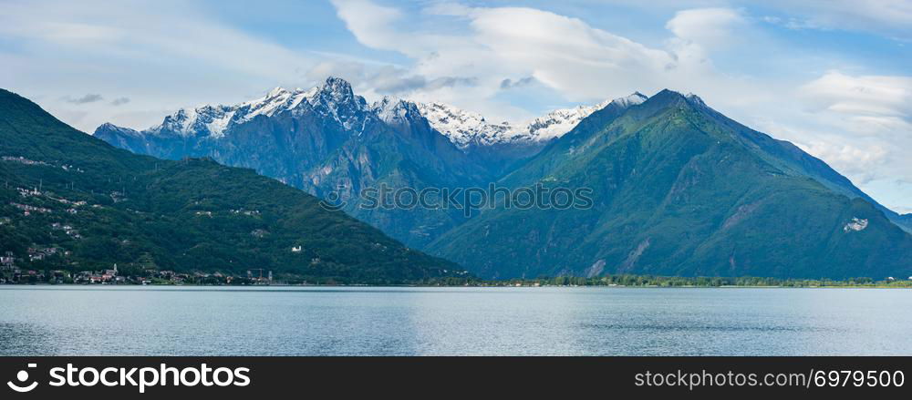 Lake Como (Italy) summer cloudy view with snow on mount top .