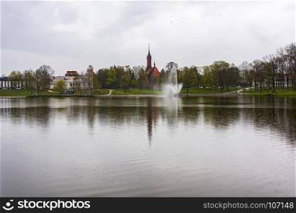 Lake Druskonis and view of the embankment in Druskininkai in cloudy weather