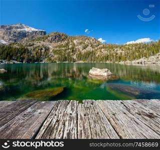 Lake Haiyaha with rocks and mountains in snow around at autumn. Rocky Mountain National Park in Colorado, USA.