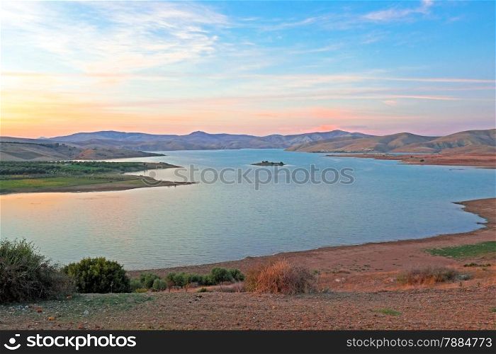 Lake in the desert at sunset in Morocco