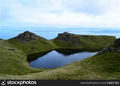 Lake in the Highlands of Scotland as seen from Old Man of Storr.
