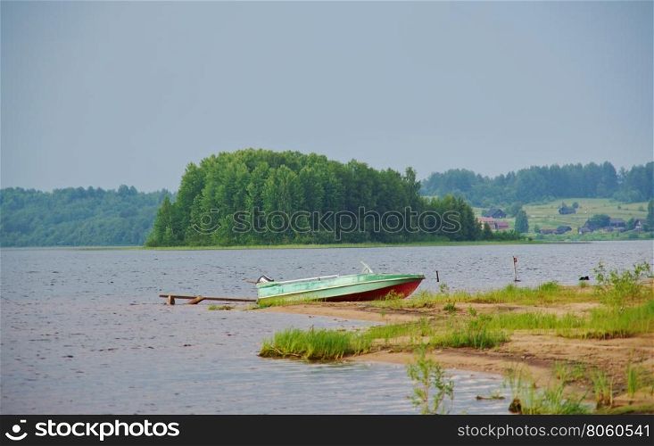 Lake Kenozero . Motor boat on the shore. Arkhangelsk region, Russia