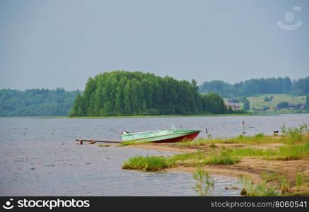 Lake Kenozero . Motor boat on the shore. Arkhangelsk region, Russia