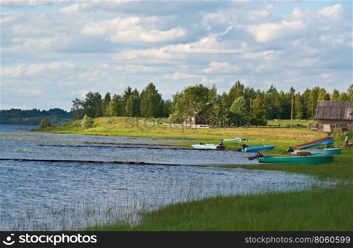 Lake Kenozero . Motor boat on the shore. Arkhangelsk region, Russia