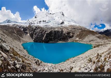 Lake Laguna 69 and Chakrarahu mountain are situated in the Huascaran National Park in the Andes of Peru.
