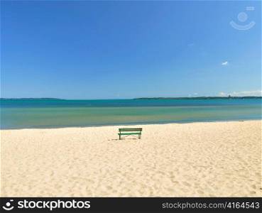 lake Michigan beach with lonely bench