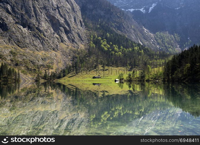 Lake Obersee in the Berchtesgaden Alps. The Fischunkelalm can be seen on the other side of the lake.. Lake Obersee near Berchtesgaden