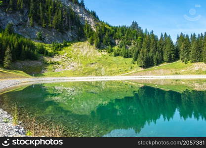 Lake of Balme and Mountain landscape in La Clusaz, Haute-savoie, France. Lake of Balme and Mountain landscape in La Clusaz, France