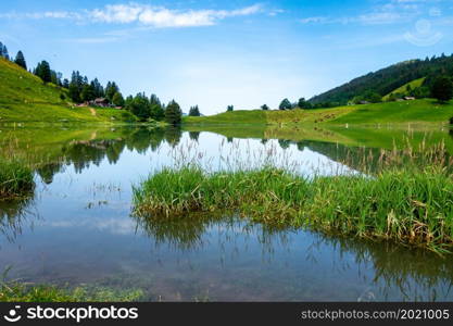 Lake of the Confins and Mountain landscape in La Clusaz, Haute-savoie, France. Lake of the Confins and Mountain landscape in La Clusaz, France