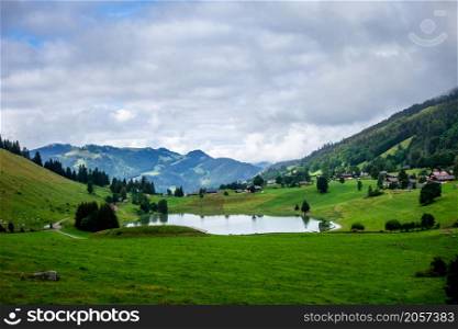 Lake of the Confins and Mountain landscape in La Clusaz, Haute-savoie, France. Lake of the Confins and Mountain landscape in La Clusaz, France