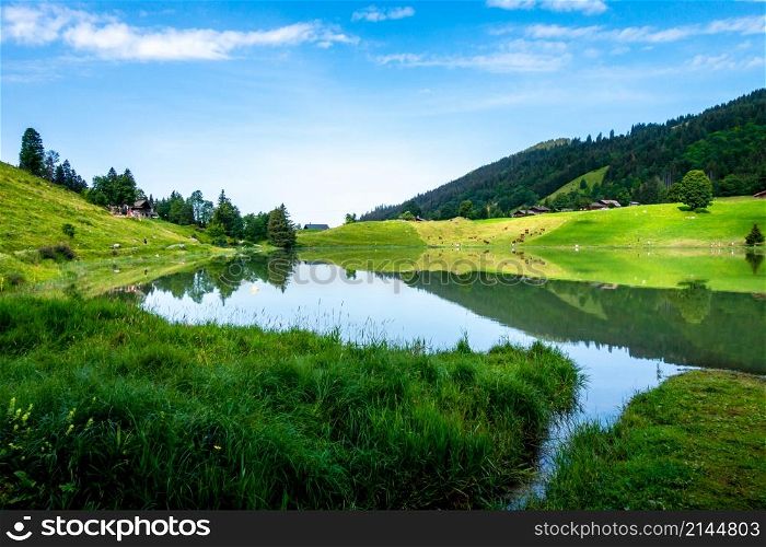 Lake of the Confins and Mountain landscape in La Clusaz, Haute-savoie, France. Lake of the Confins and Mountain landscape in La Clusaz, France