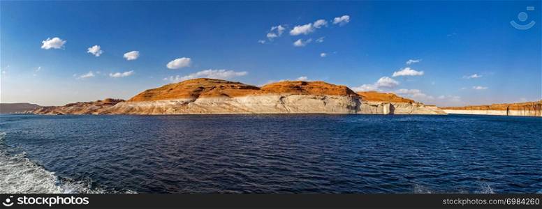 Lake Powell is based on Colorado River with a great view on the canyoon. Beautiful canyon and lonely rocks on the Lake Powell, Utah.. Beautiful canyon and lonely rocks on the Lake Powell