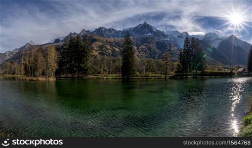 Lake reflection in the middle of the mountains in Chamonix, French Alps