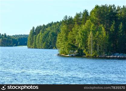 Lake summer view with forest on the edge ( Finland).