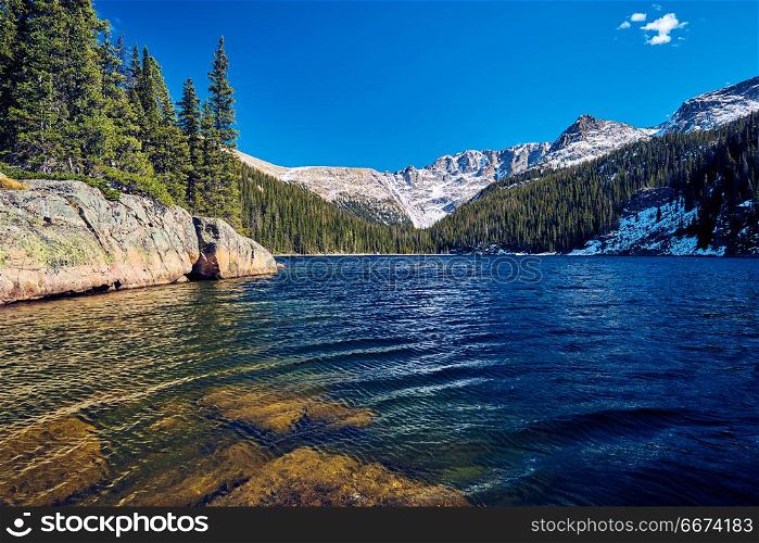Lake Verna, Rocky Mountains, Colorado, USA. . Lake Verna with rocks and mountains around at autumn. Rocky Mountain National Park in Colorado, USA.