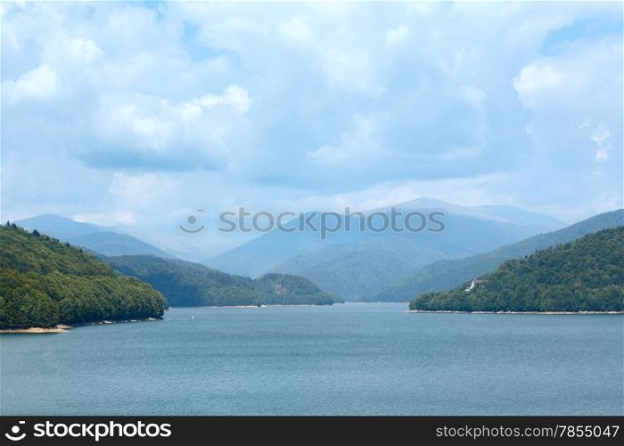 Lake Vidraru summer cloudy landscape (Romania).