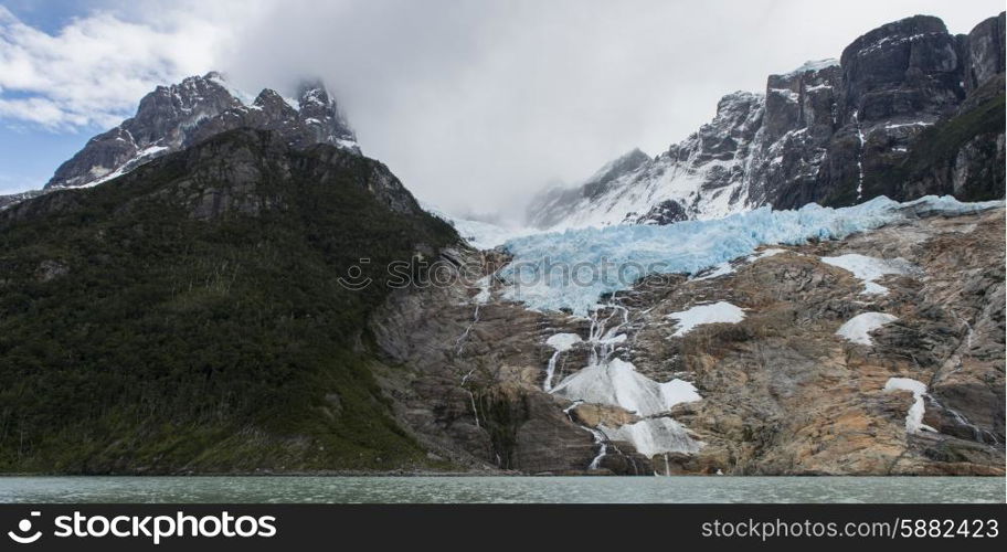 Lake with mountain range in the background, Grey Lake, Torres del Paine National Park, Patagonia, Chile