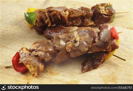Lamb kebab skewers coated in a marinade and ready for grilling or barbecuing