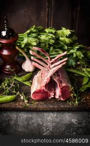 Lamb meat cooking on dark rustic kitchen table, top view, border