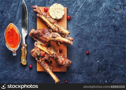 lamb ribs baked in the oven on the kitchen board