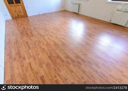 Laminate on the floor of the room after a major overhaul in the apartment