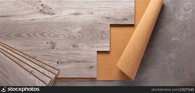 Laminate wood floor on cork background texture. Wooden laminate floor and corkboard with copy space