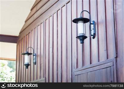 Lamp decorated on wooden wall, stock photo