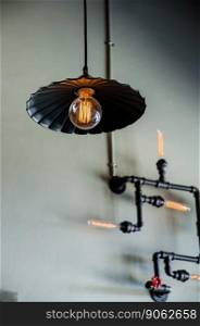 lamp hanging with steel pipe on wall
