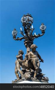 Lamp in the beautiful Alexander III bridge in Paris