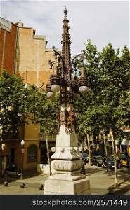 Lamppost in front of a building, Barcelona, Spain