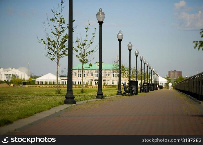Lampposts in a row along a walkway, New York City, New York State, USA