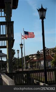 Lampposts near an American flag, Cocoa, Florida, USA