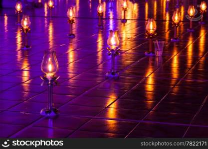 Lamps were lit and placed on the ground. A row in the temple. To religious blessings.