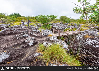 Lan Hin Teak Nameplate and large stone courtyard with strange stone shapes is a famous natural tourist attraction of Phu Hin Rong Kla National Park, Phitsanulok Province, Thailand. Lan Hin Teak Nameplate