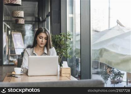 lance woman working with laptop coffee shop