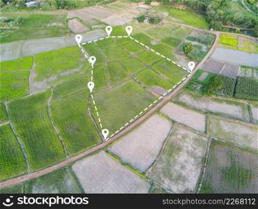 Land plot in aerial view, Top view land green field agriculture plant with pins, pin location icon for housing subdivision residential development owned sale rent buy or investment countryside suburbs