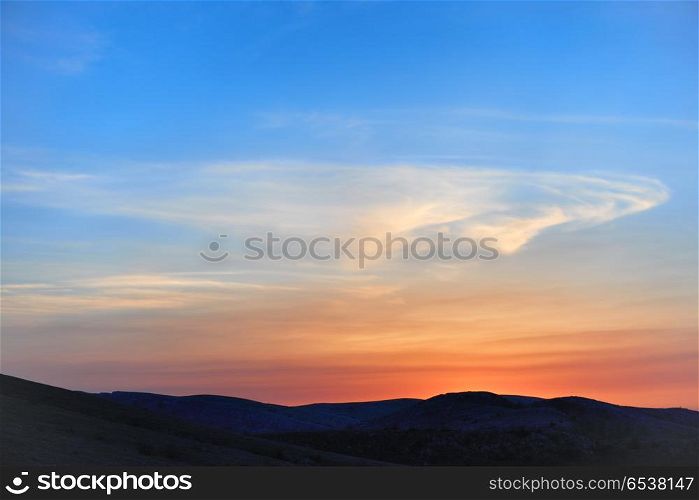 Land with and dramatic colorful sky at sunset. Land with and dramatic sky