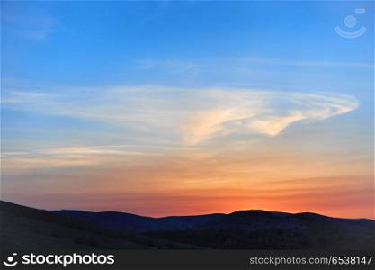 Land with and dramatic colorful sky at sunset. Land with and dramatic sky