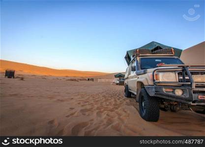 Landcruiser standing in the Namib desert, Namibia.