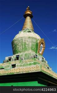 Landmark of a historic green stupa in Tibet