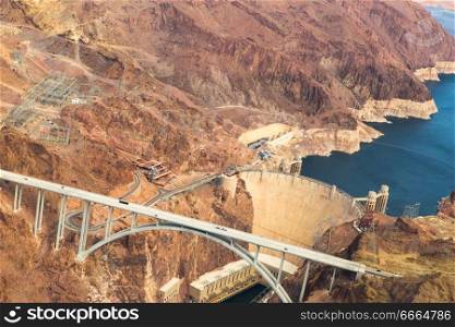 landscape and infrastructure and concept - aerial view of mike callaghan-pat tillman memorial bridge over colorado river and hoover dam at grand canyon from helicopter. mike callaghan-pat tillman bridge, grand canyon