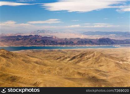landscape and nature concept - aerial view of grand canyon and lake mead from helicopter. aerial view of grand canyon and lake mead