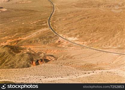 landscape and nature concept - aerial view of road in grand canyon desert from helicopter. aerial view of road in grand canyon desert