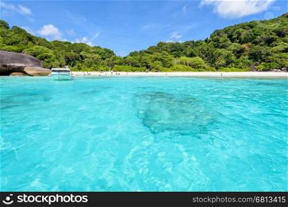 Landscape beautiful blue sea and summer sky above the bay front beach was used as a quay speed boat of tourist at Koh Similan Islands in Mu Ko Similan National Park, Phang Nga province, Thailand