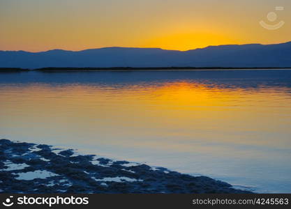 Landscape Dead Sea shortly before dawn, salt, water and the Jordanian mountains in the background.