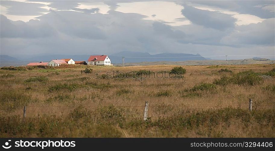 Landscape, farmstead in fenced pasture