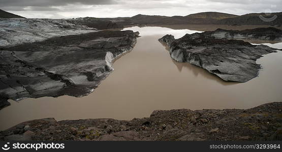 Landscape, glaciers melting in glacial lake, moraine at front