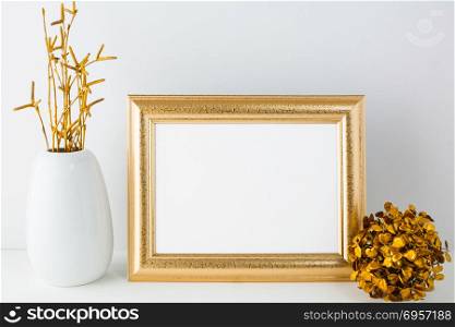 Landscape gold frame mockup with golden decor. Gold frame mockup with golden decor. Landscape white frame mockup. Empty white frame mockup for presentation artwork.