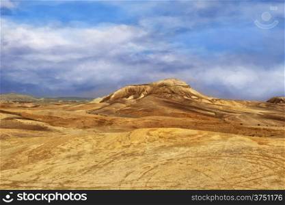Landscape in the Judean desert. A beautiful combination of blue sky and bright yellow hills.